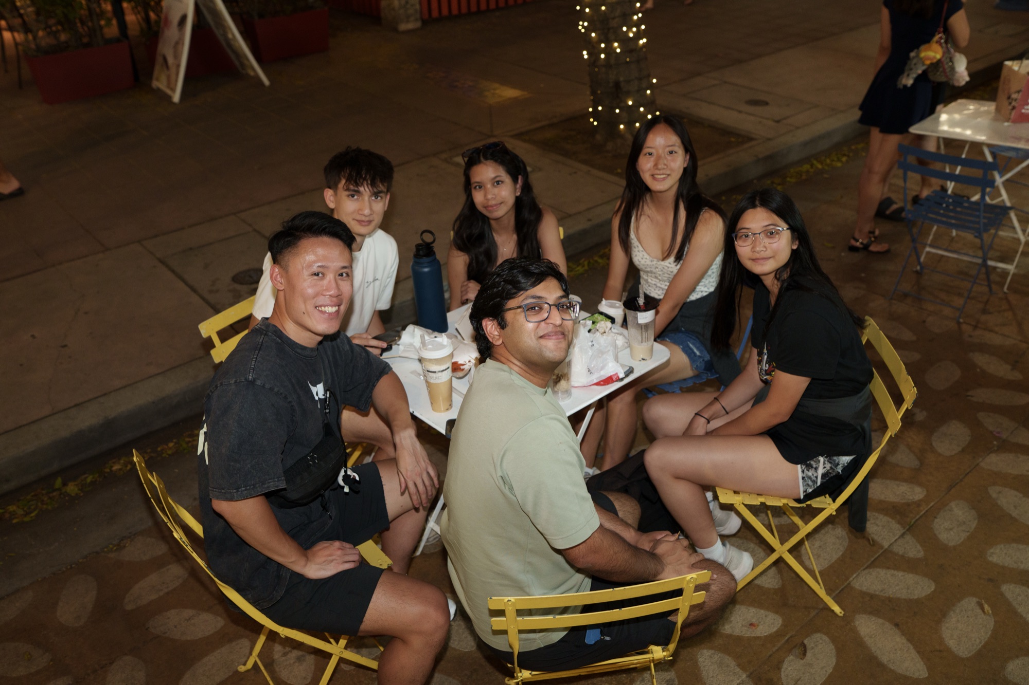 Friends gathered around a table at NightBite
